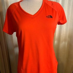 Women’s North Face v neck size medium.